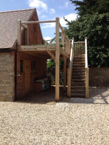 Oak framed balcony with stairs by Shires Oak Buildings