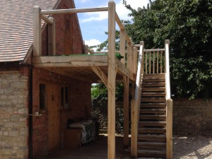 Oak framed balcony with stairs by Shires Oak Buildings