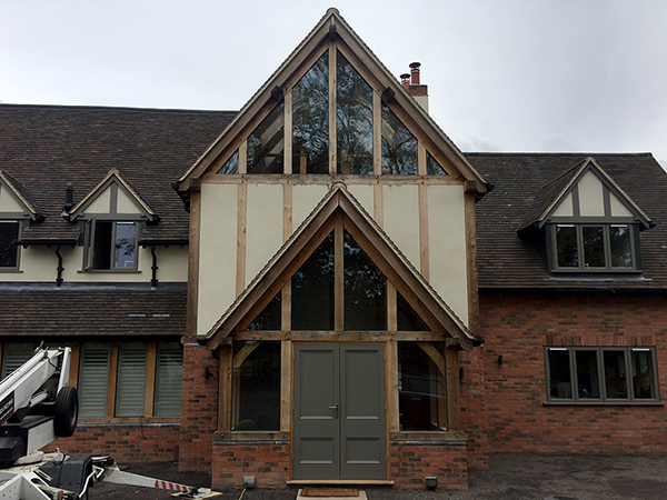 Oak framed 2 storey gable and porch extensions by Shires Oak Buildings