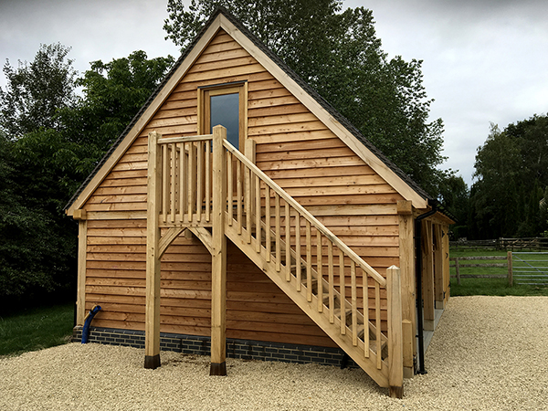 Oak framed 3 bay room over garage, stairs and side view, by Shires Oak Buildings