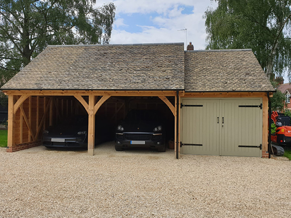 Oak framed 3 bay garage with equal eaves by Shires Oak Buildings