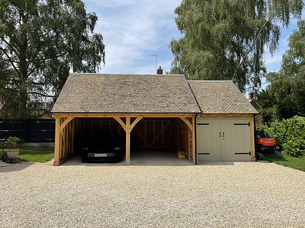 Oak framed 3 bay garage with equal eaves by Shires Oak Buildings
